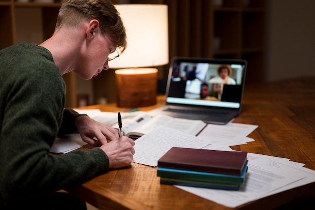 Young man learning in a virtual classroom