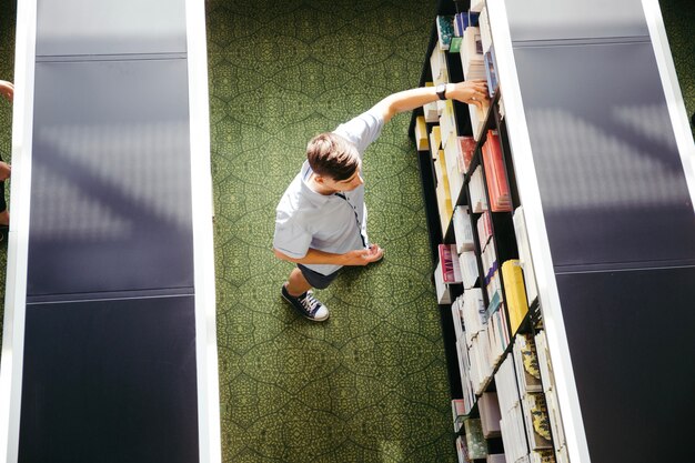 Young man in library