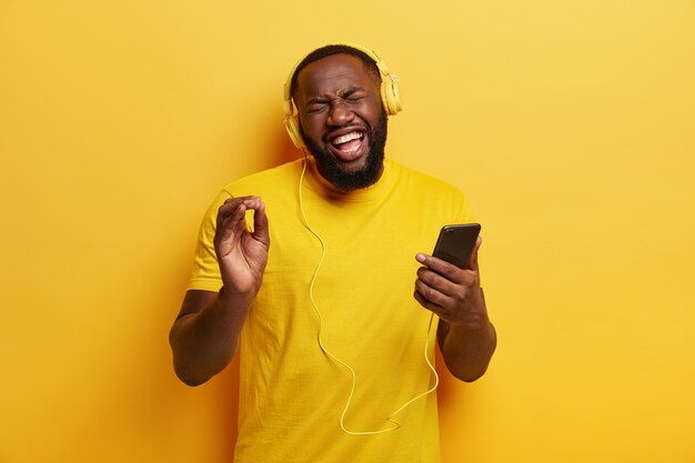 Young man listening to music in headphones
