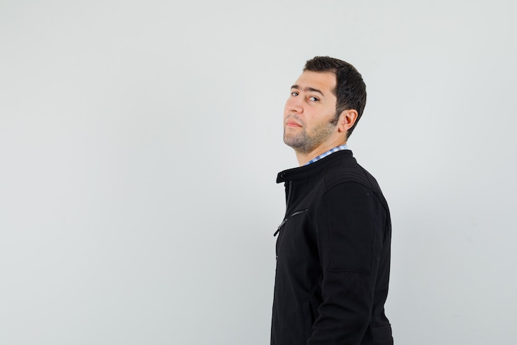Free Photo young man looking at camera in shirt, jacket and looking confident .