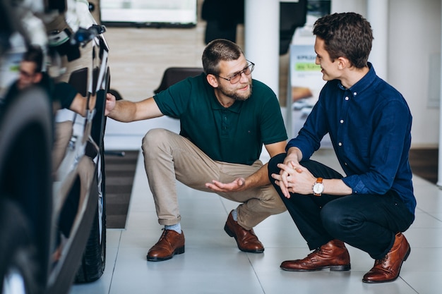 Young man looking for a car to rent