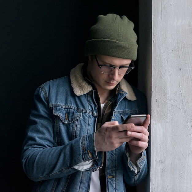 Young man looking at his phone