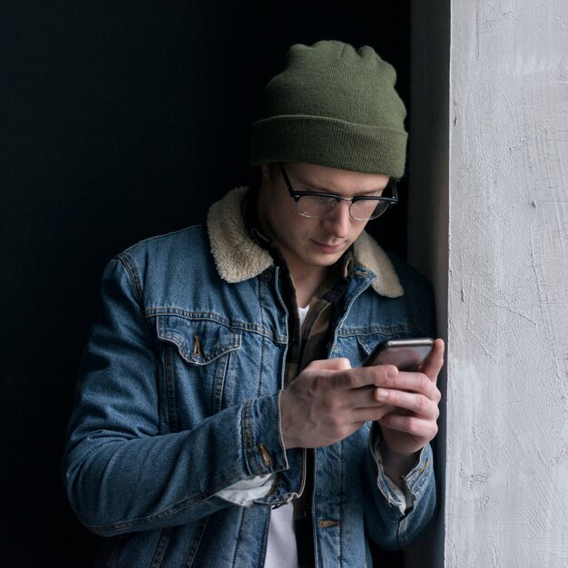 Young man looking at his phone
