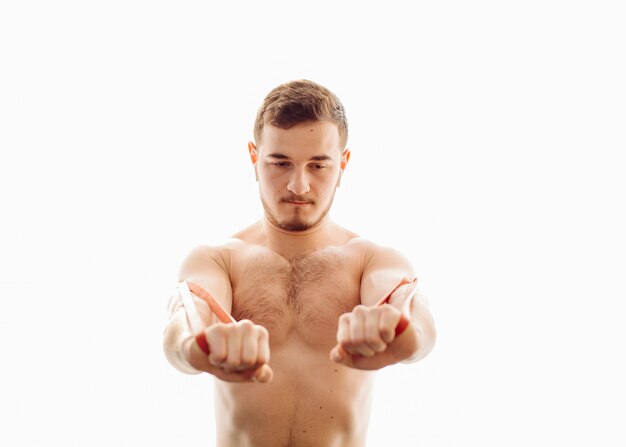 Young man making sport exercises at home