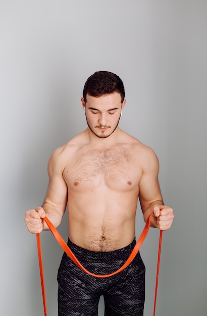 Young man making sport exercises at home