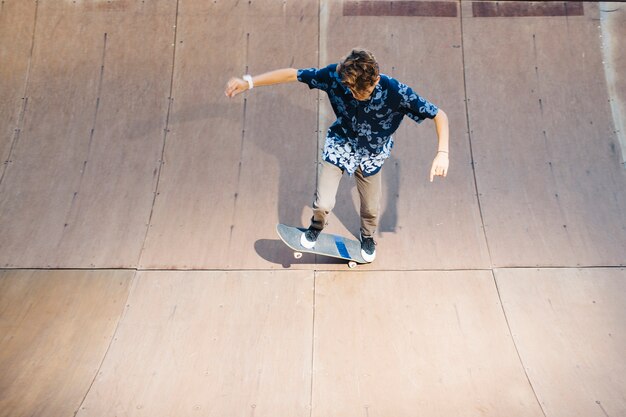 Young man making a trick with skate