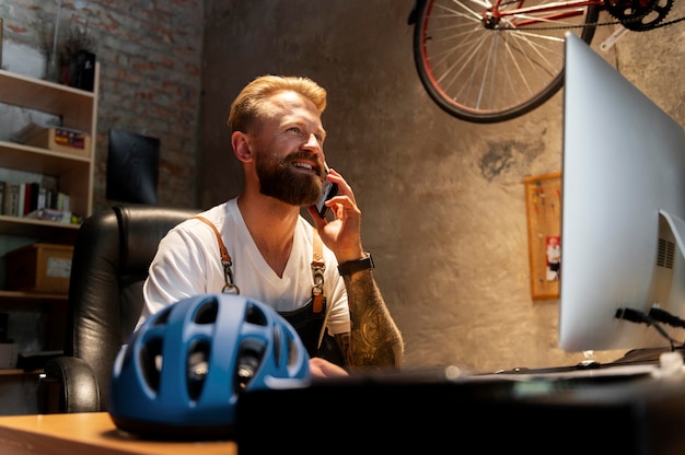 Young man managing his bike business