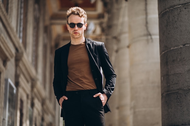 Young man model posing in the street