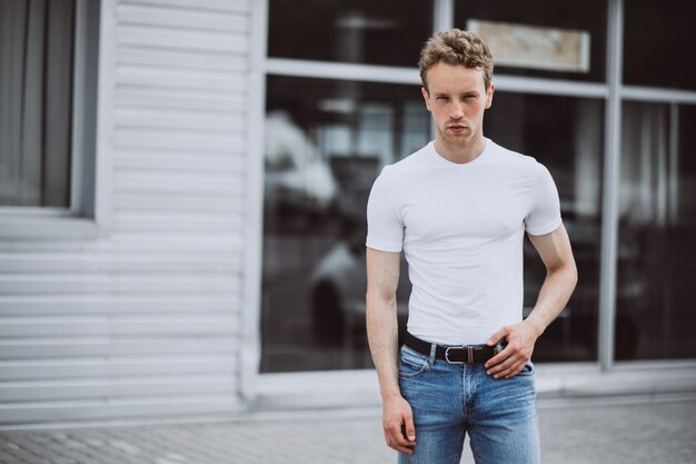 Young man model posing in the street