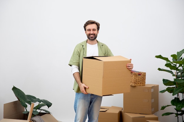 Young man moving in new home