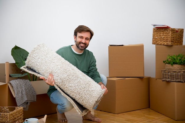 Young man moving in new home