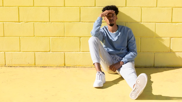 Free photo young man outdoor sitting