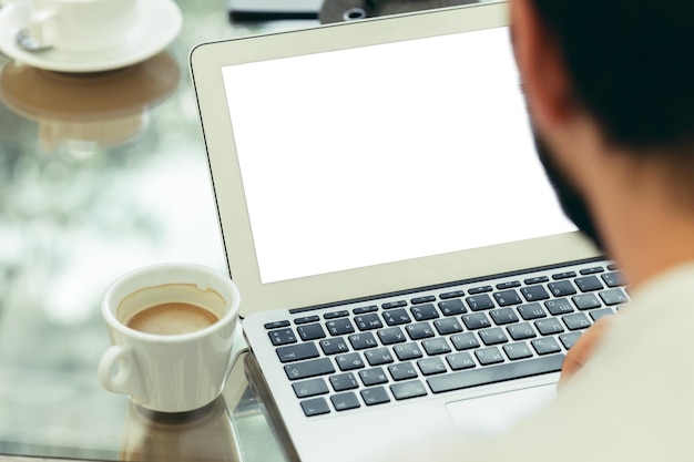 Free photo young man performs work on a laptop