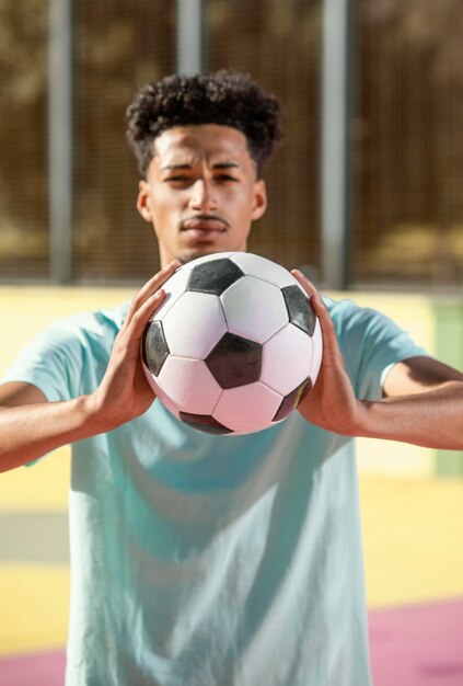 Young man playing football
