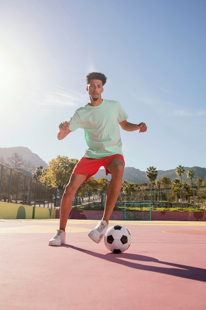 Free photo young man playing football