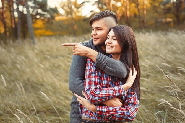 Young man pointing something to his girlfriend