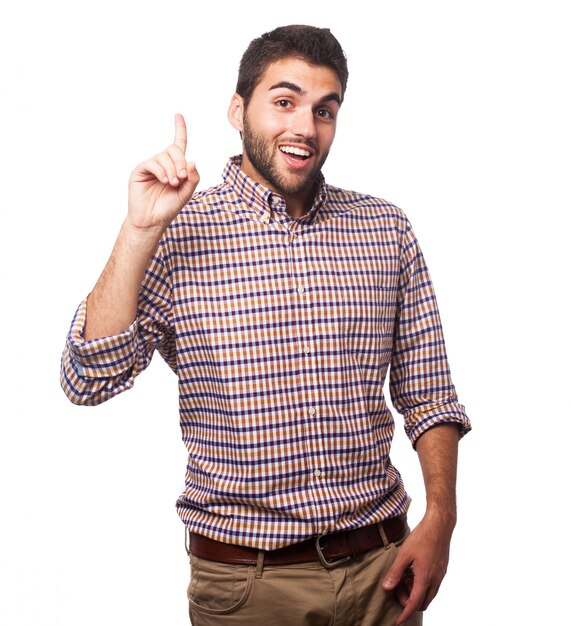 Young man pointing up with index finger.