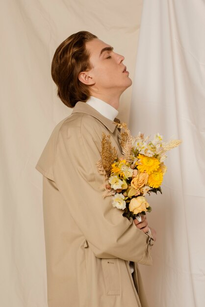 Young man portrait with flowers