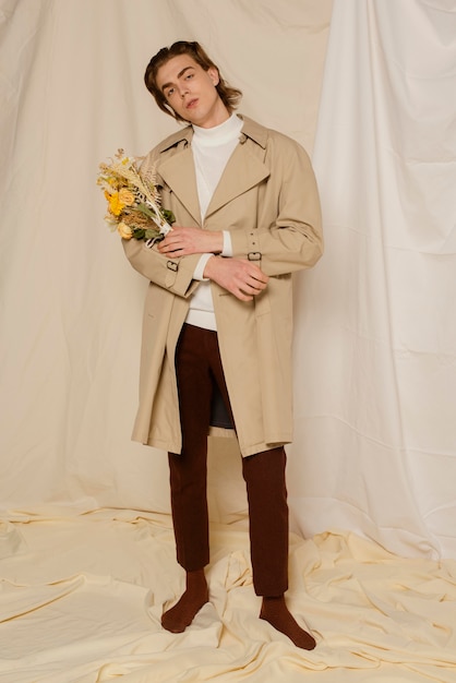 Young man portrait with flowers