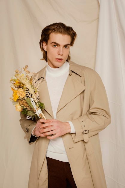 Young man portrait with flowers