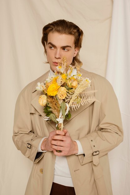 Young man portrait with flowers