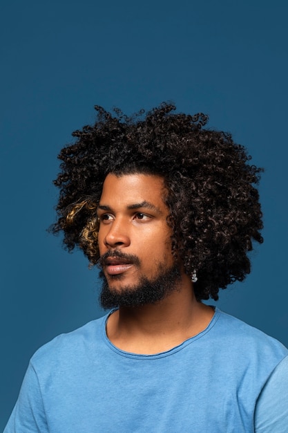 Young man posing in studio medium shot