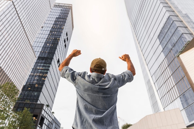 Young man raising his fists in the air