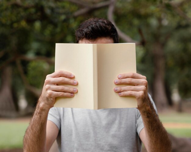 Young man reading an interesting book