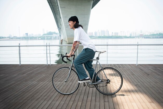 Young man riding his bike