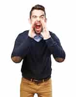 Free photo young man screaming with hands near the mouth