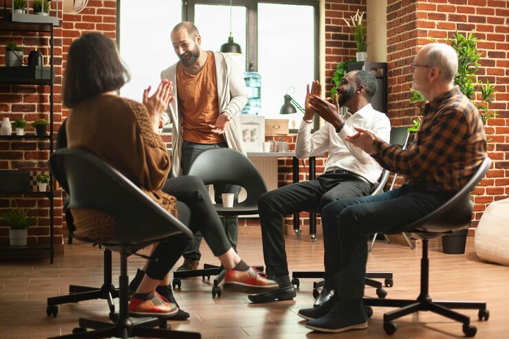 Free Photo young man sharing success story at rehab