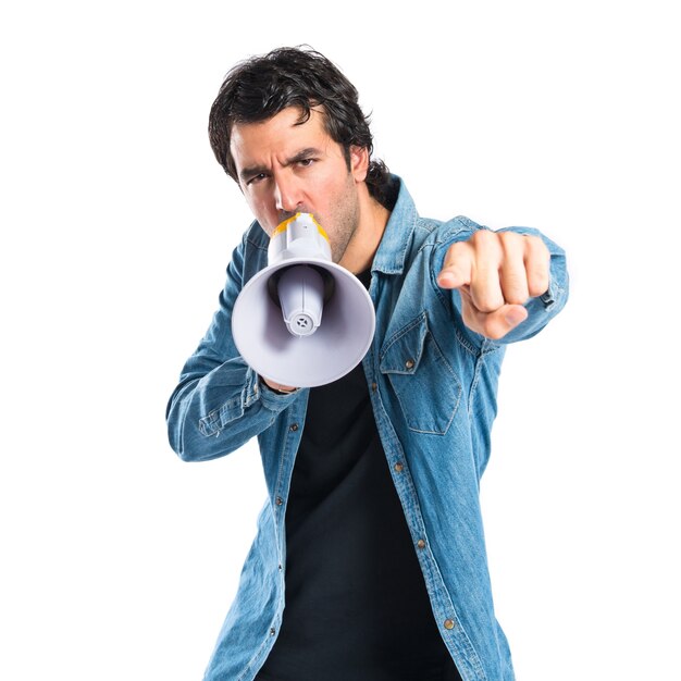 Young man shouting over isolated white background