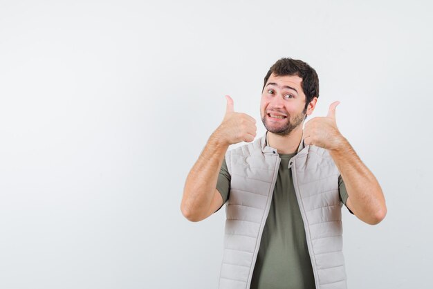 Young man showing a good hand sign on white background