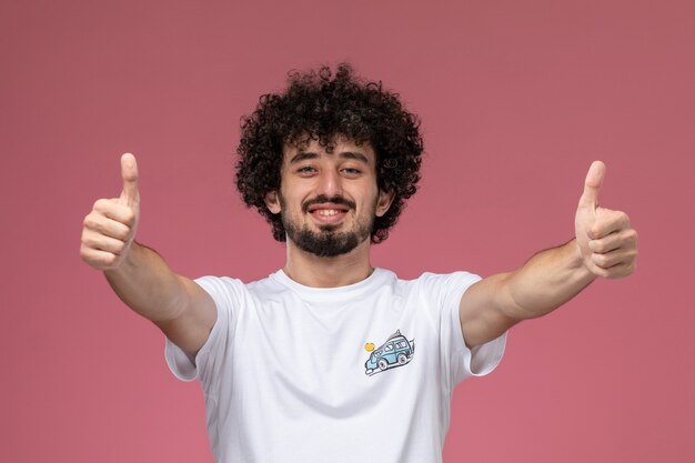 young man showing two thumbs up