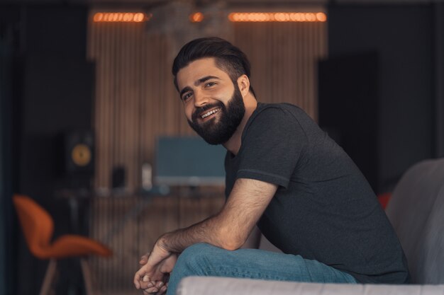 Young man sitting relaxing on the couch