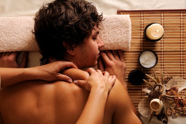 The young Man on spa treatment - recreation,  rest,  relaxation and massage. Hygh angle view