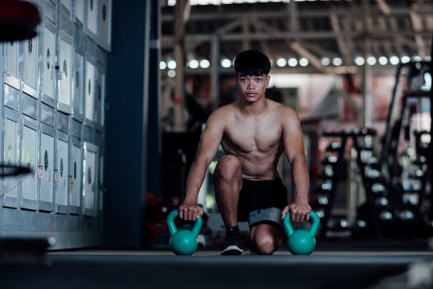 Young man in sportswear an exercise class in a gym