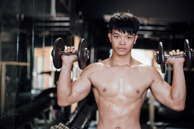 Young man in sportswear an exercise class in a gym