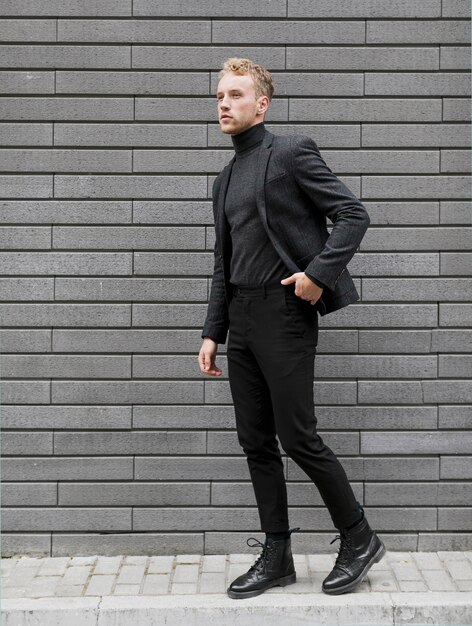 Young man on the street with one hand in his pocket