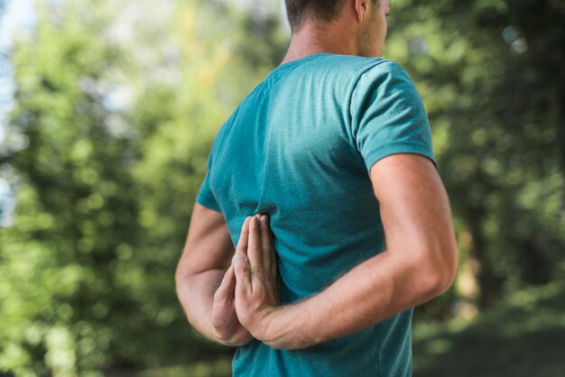 Young man stretching in the park