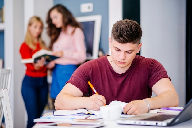 Young man studying at table