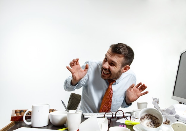 Free photo young man suffering from the noise in the office