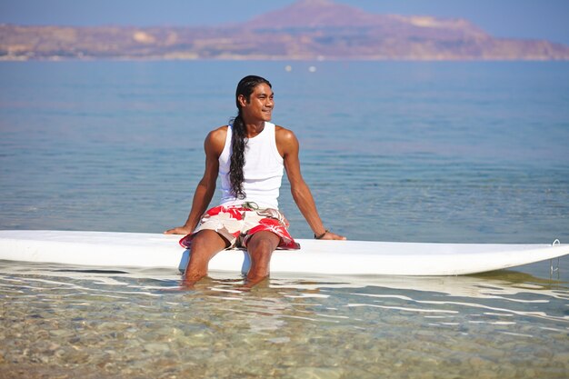 Young man on a surfboard