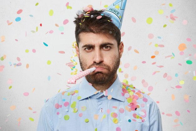 Young man surrounded by confetti