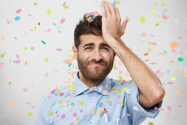 Young man surrounded by confetti