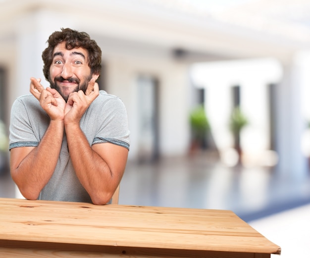 young man on a table. worried expression