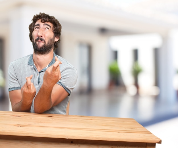 young man on a table. worried expression