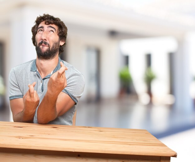 young man on a table. worried expression