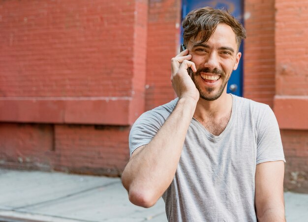 Young man talking over the phone