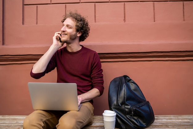 Young man talking on the phone.